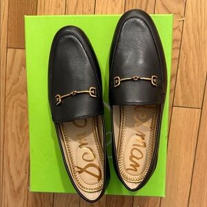 Black Leather Loafers with Gold Detailing